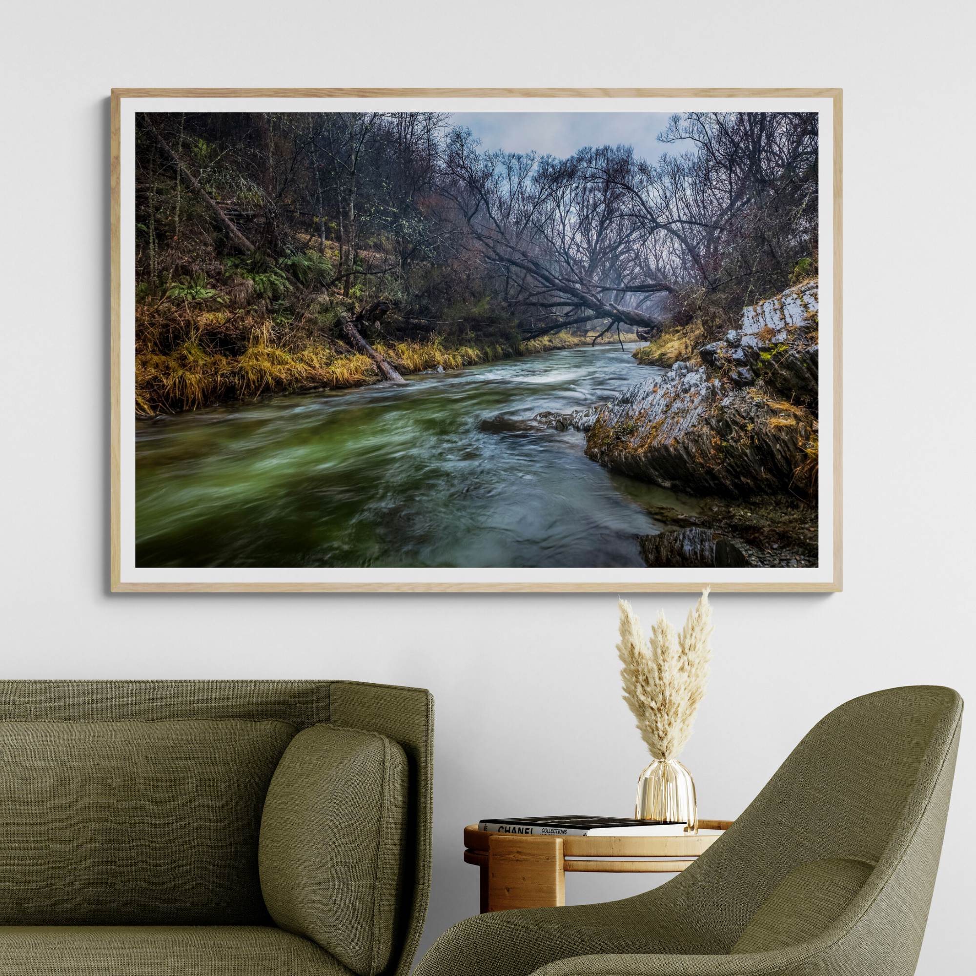 Arrowtown River Print with natural frame in living room by Kirsten Clark photographer
