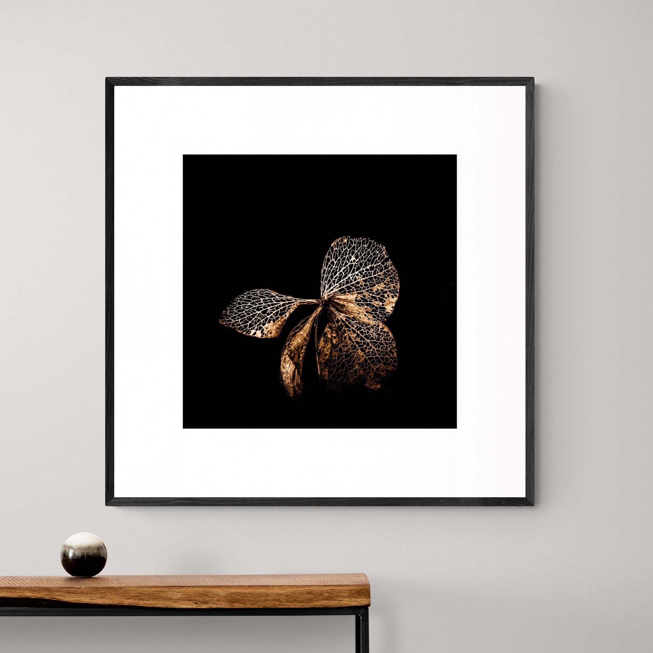 Hydrangea Butterfly Print with black frame above console by Kirsten Clark Art