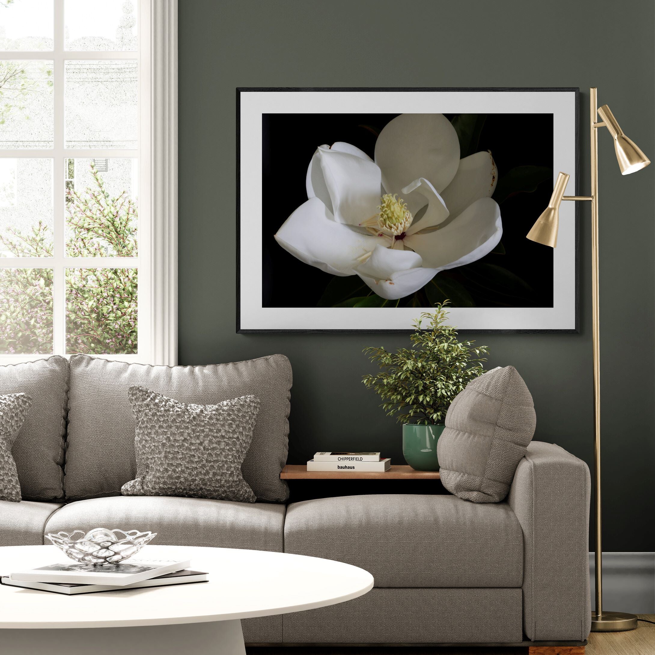 Magnolia III floral print in contemporary living room with soft green wall and charcoal frame.