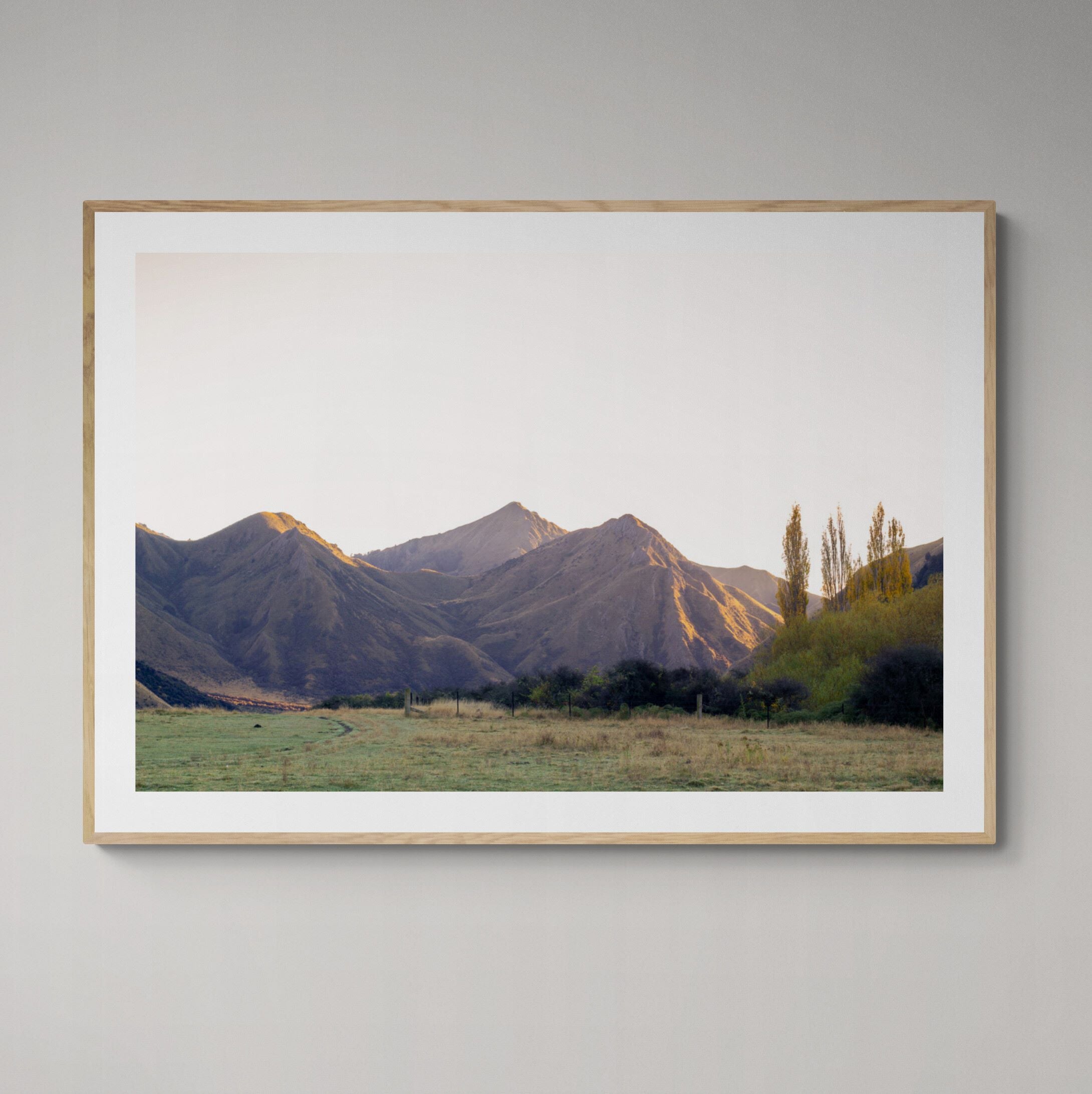 Moke Lake Queenstown Autumn Sunrise print framed on the wall by Kirsten Clark Art