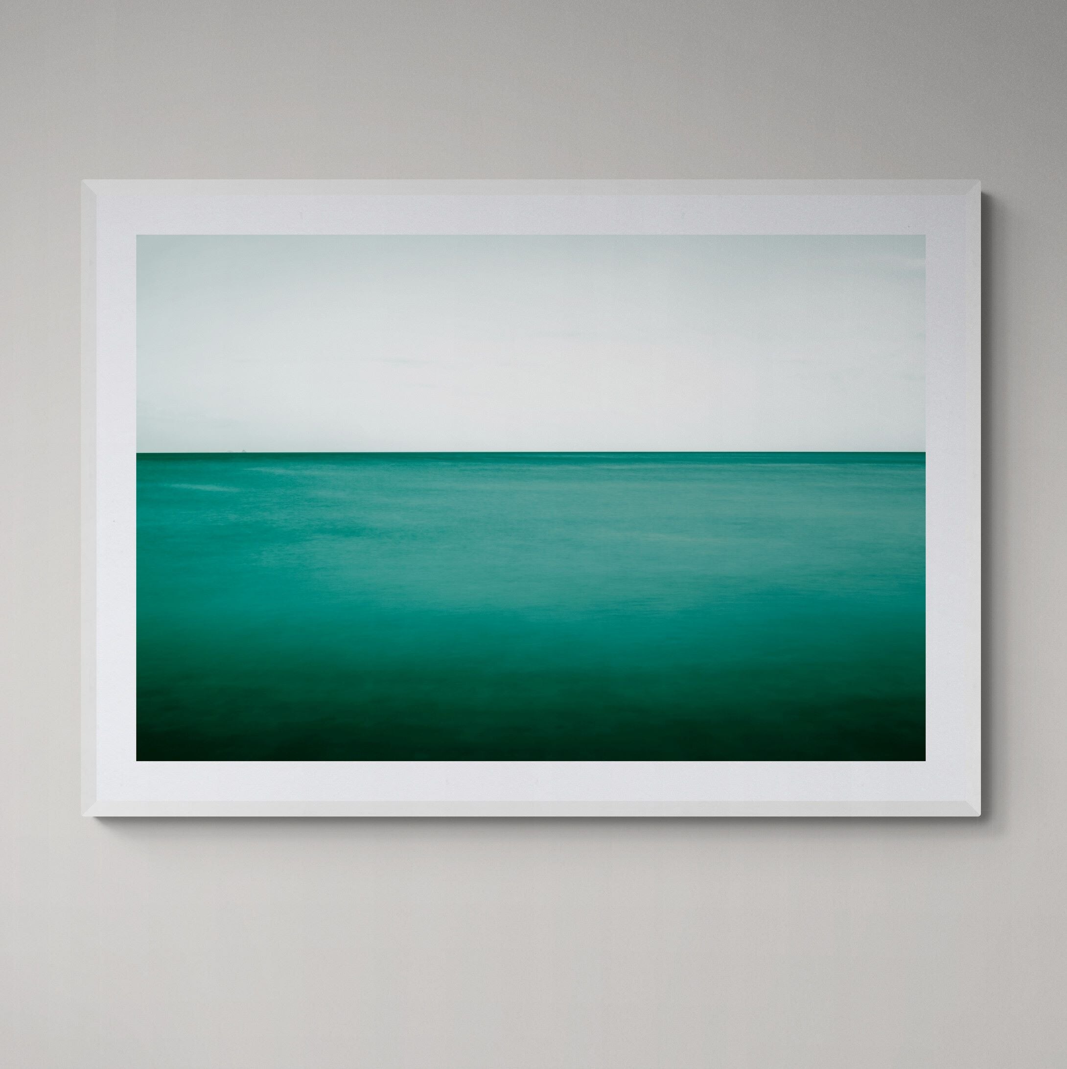 New Horizons Emerald Sea print framed on the wall by Kirsten Clark Art