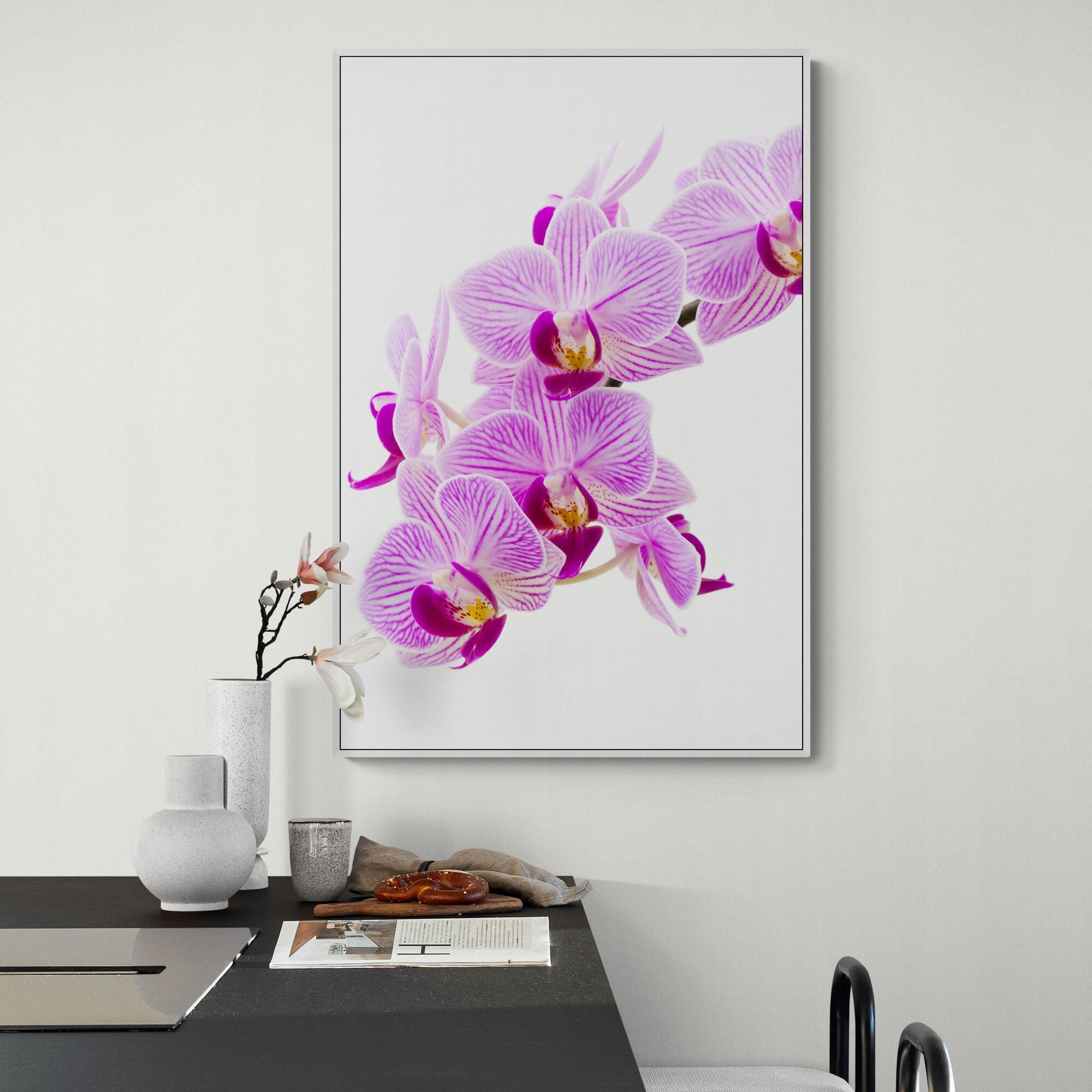 Pink orchid on the wall in kitchen counter living space.jpg