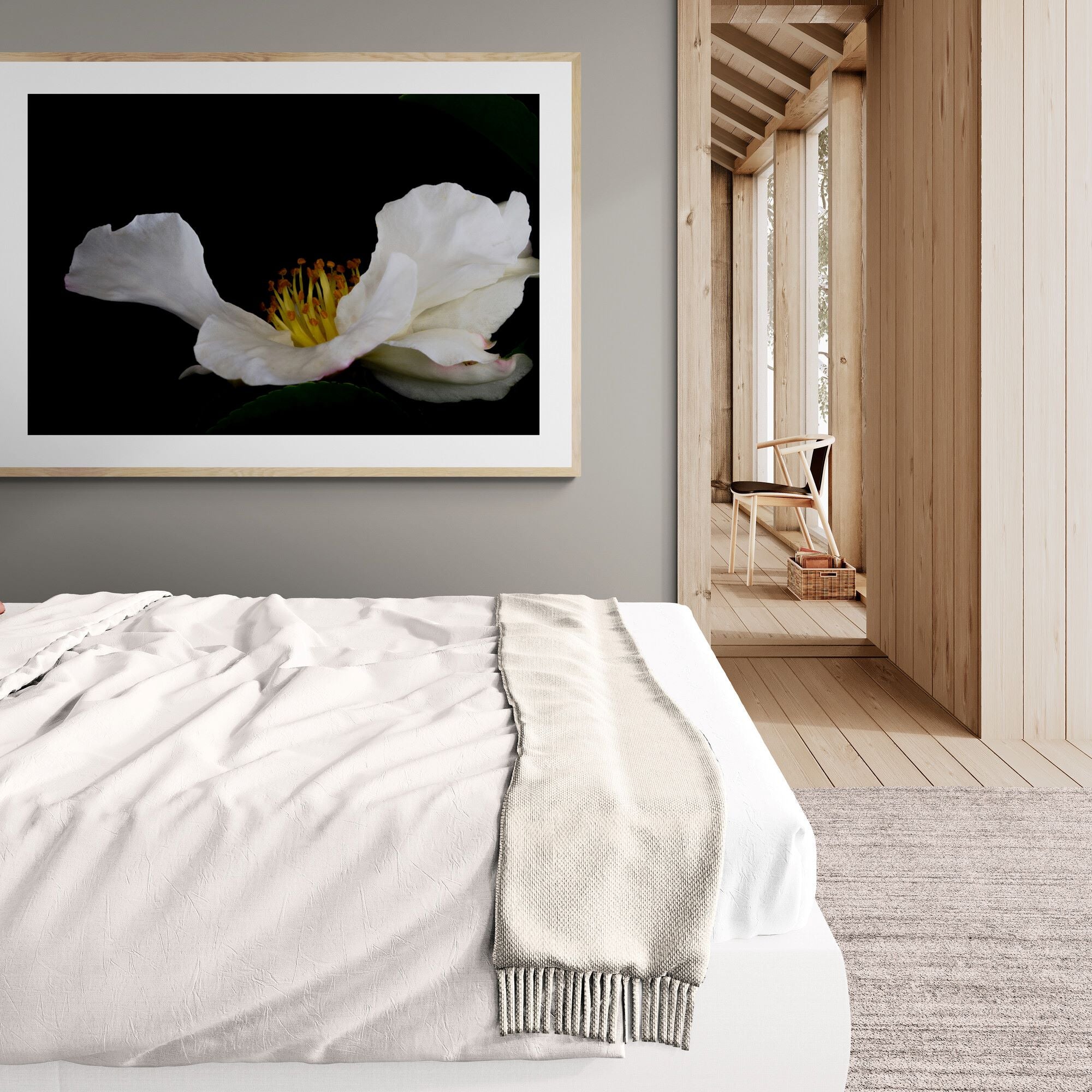 white camellia print in oak frame in bright-bedroom-with-wooden-walls by Kirsten Clark Art