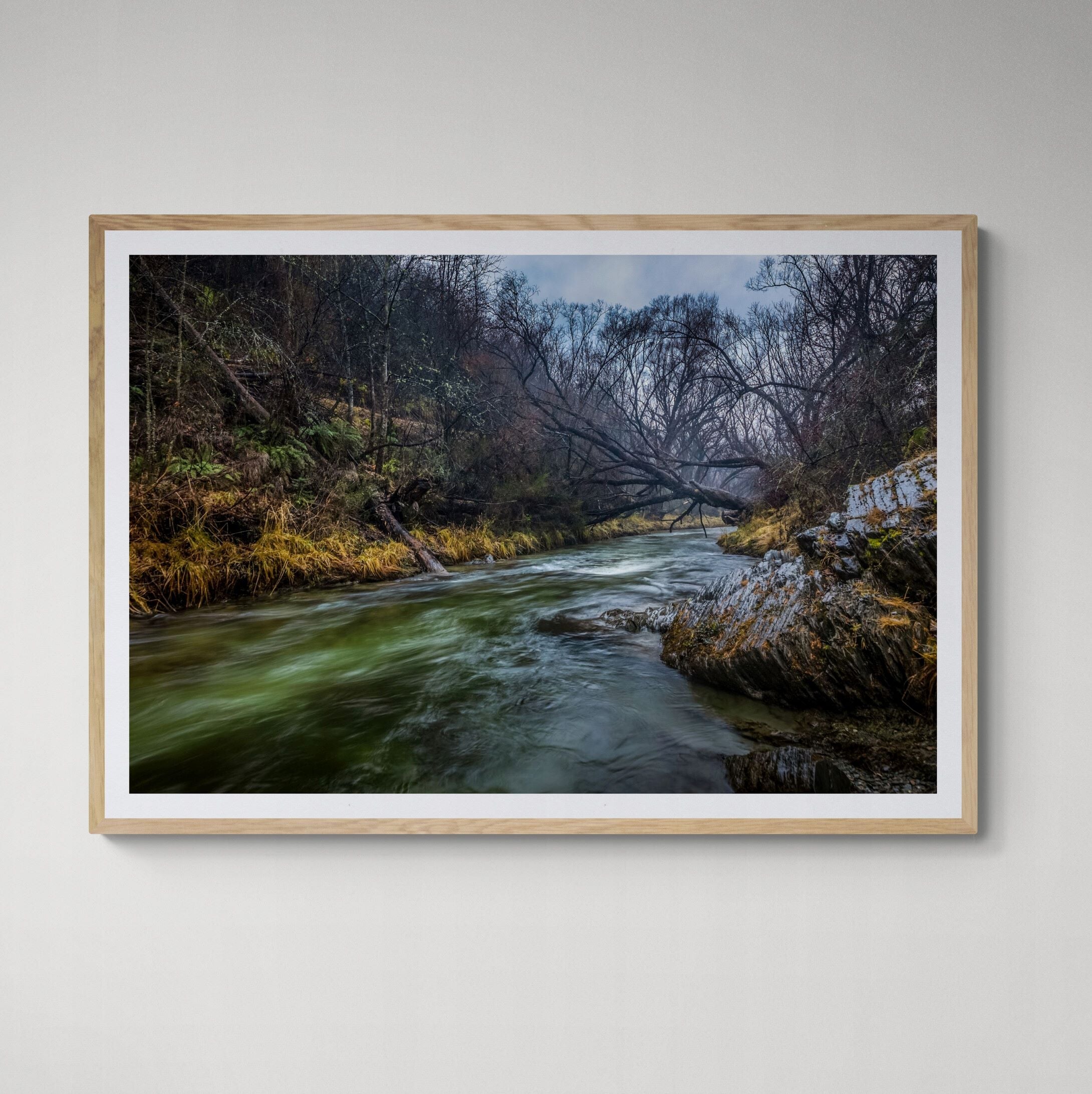 Arrowtown River Print in natural frame on wall by Kirsten Clark Art