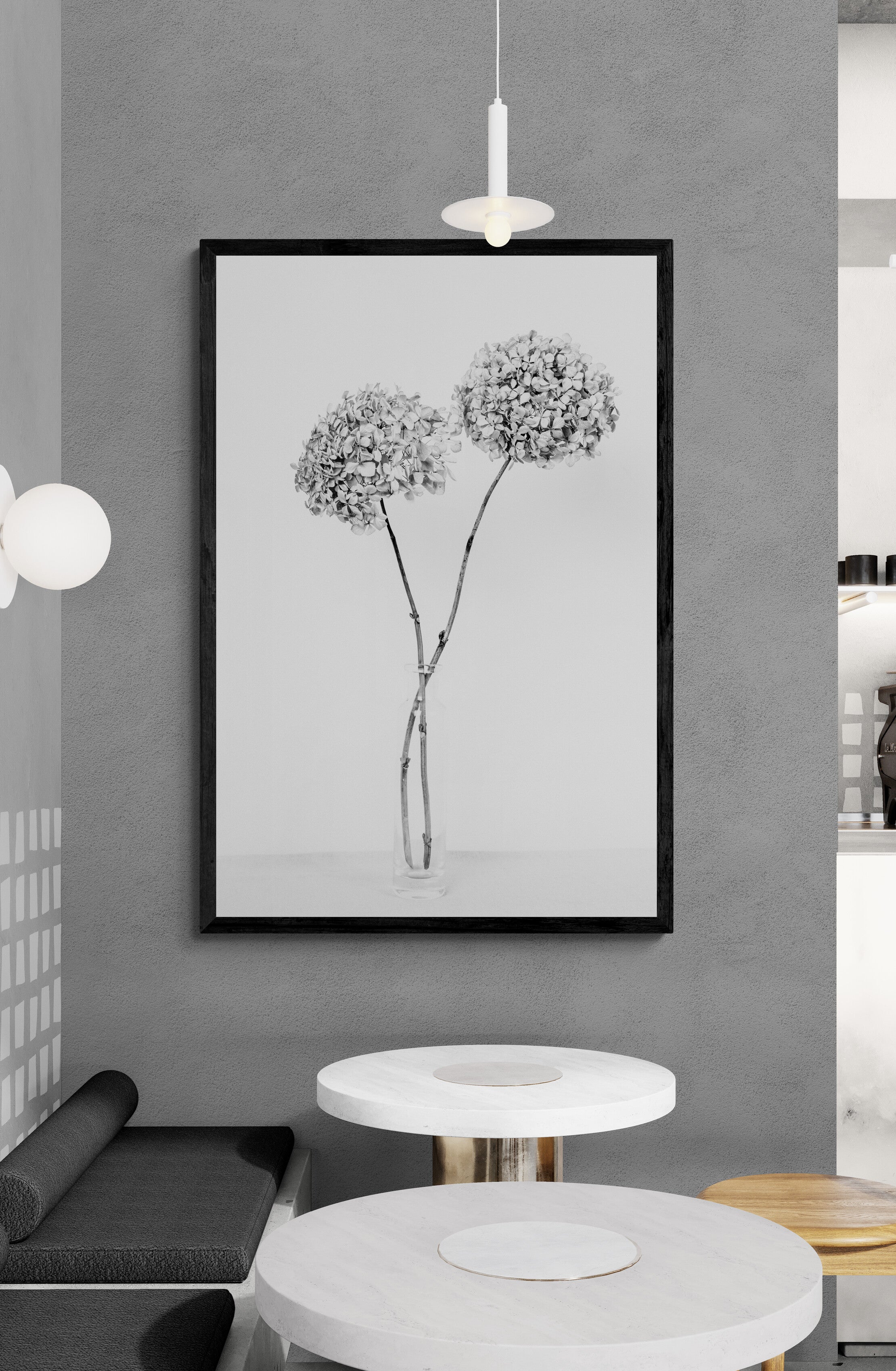 Framed black and white floral artwork on a gray wall with modern decor.