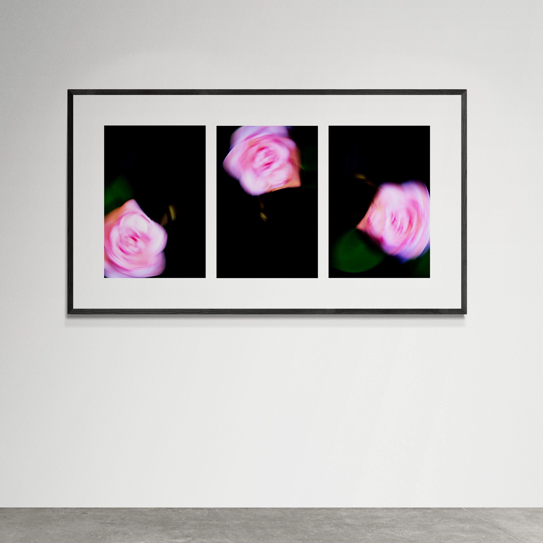 Camellia Swirl Print in black frame on art gallery wall