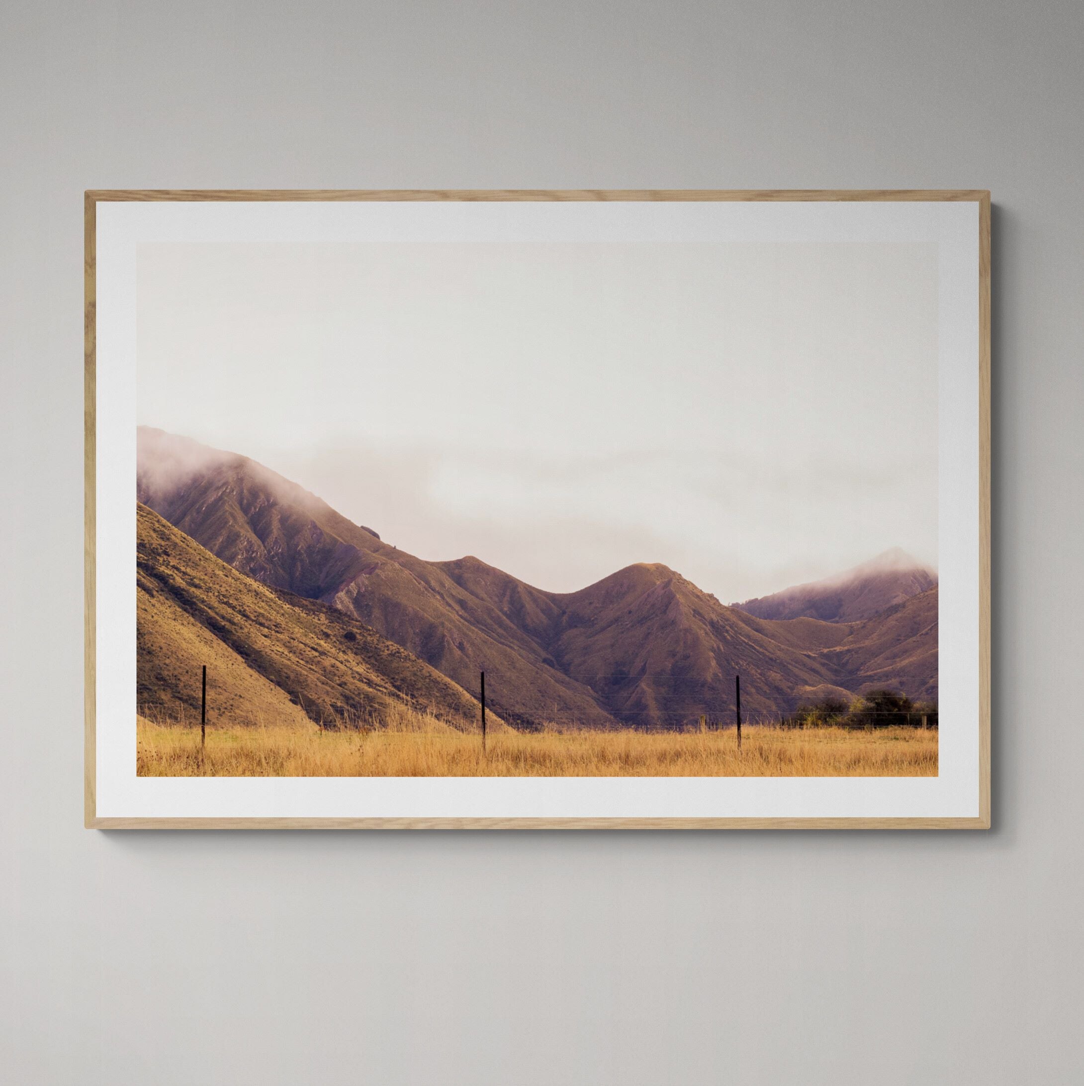 Golden Mountains Queenstown Print framed on wall by Kirsten Clark Art