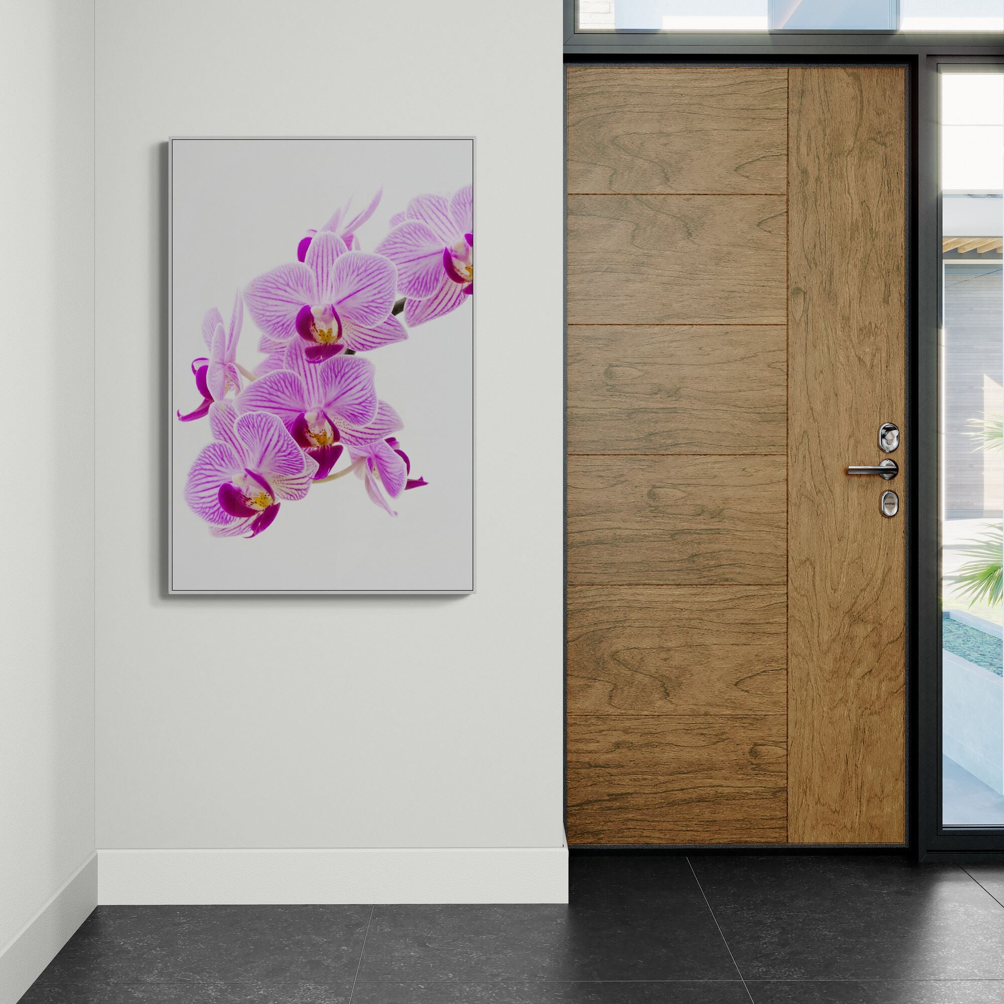 Pink orchid canvas print on wall in foyer by Kirsten Clar Art