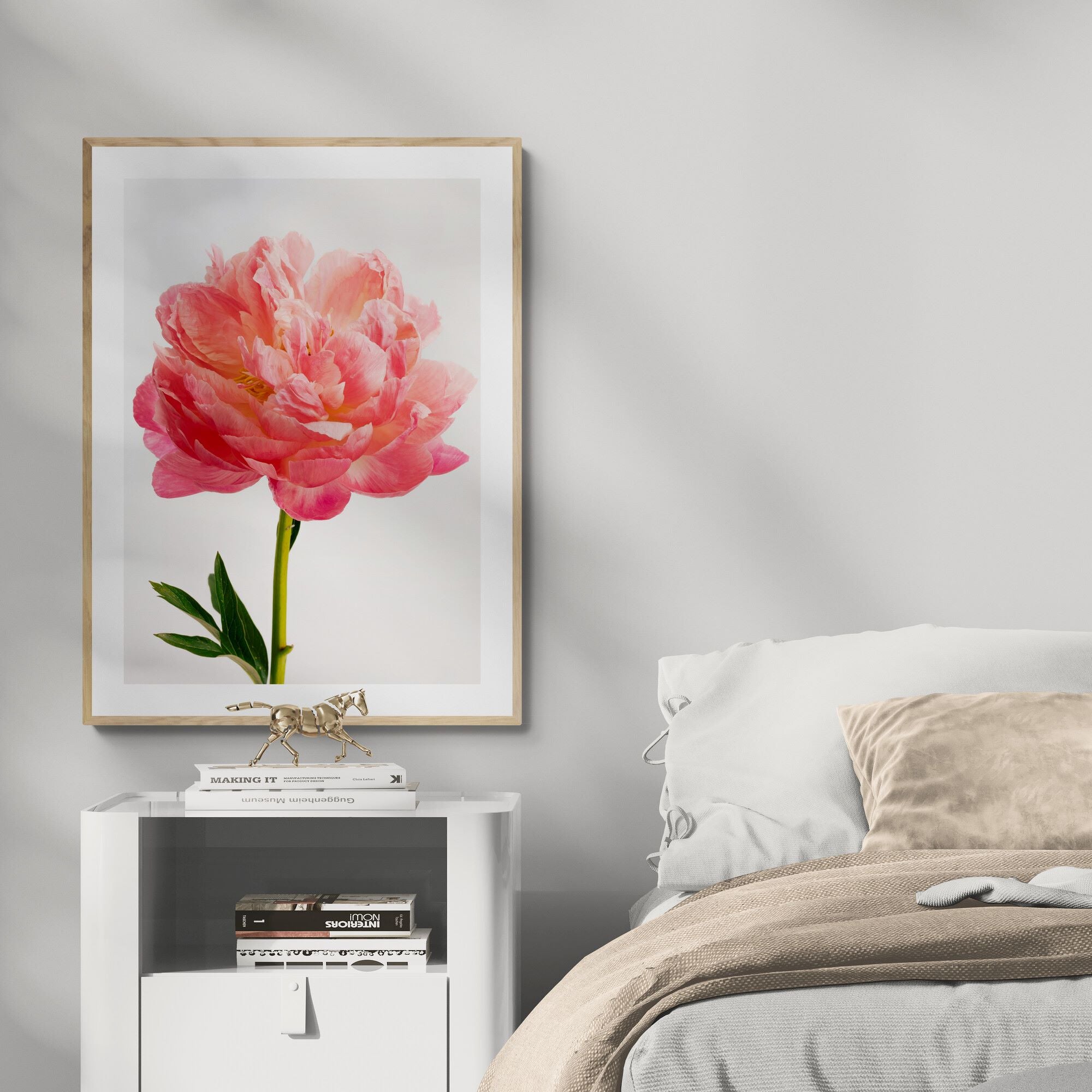 coral charm peony print in bedroom by Kirsten Clark Art