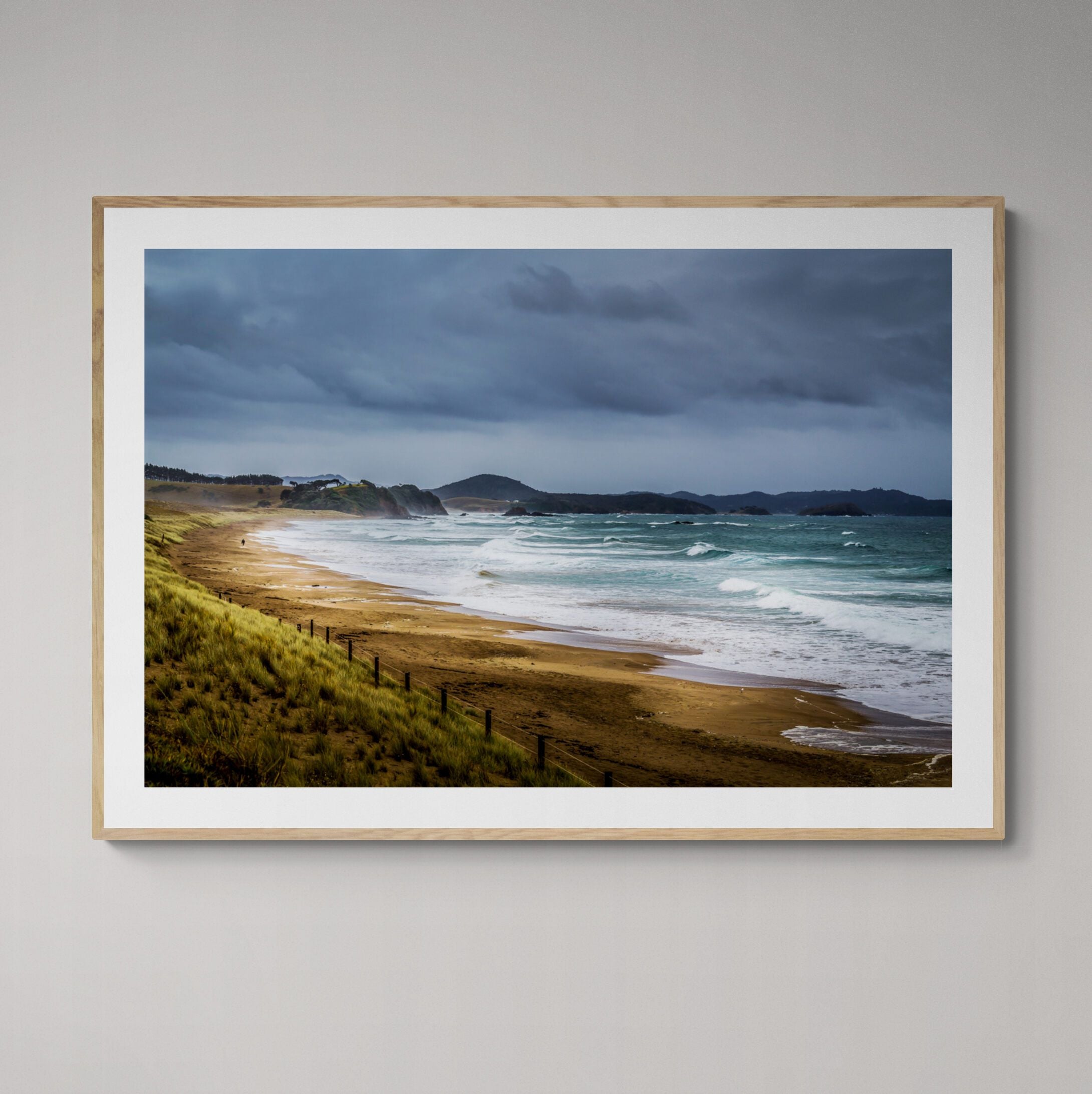 pataua_north_beach_print_with_oak_frame_on_wall by Kirsten Clark art